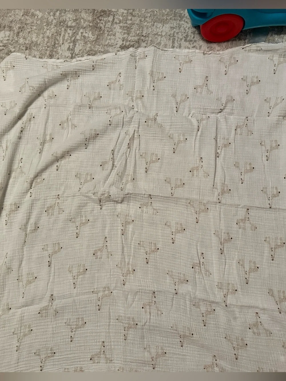 Aden white muslin swaddle blanket with giraffe print